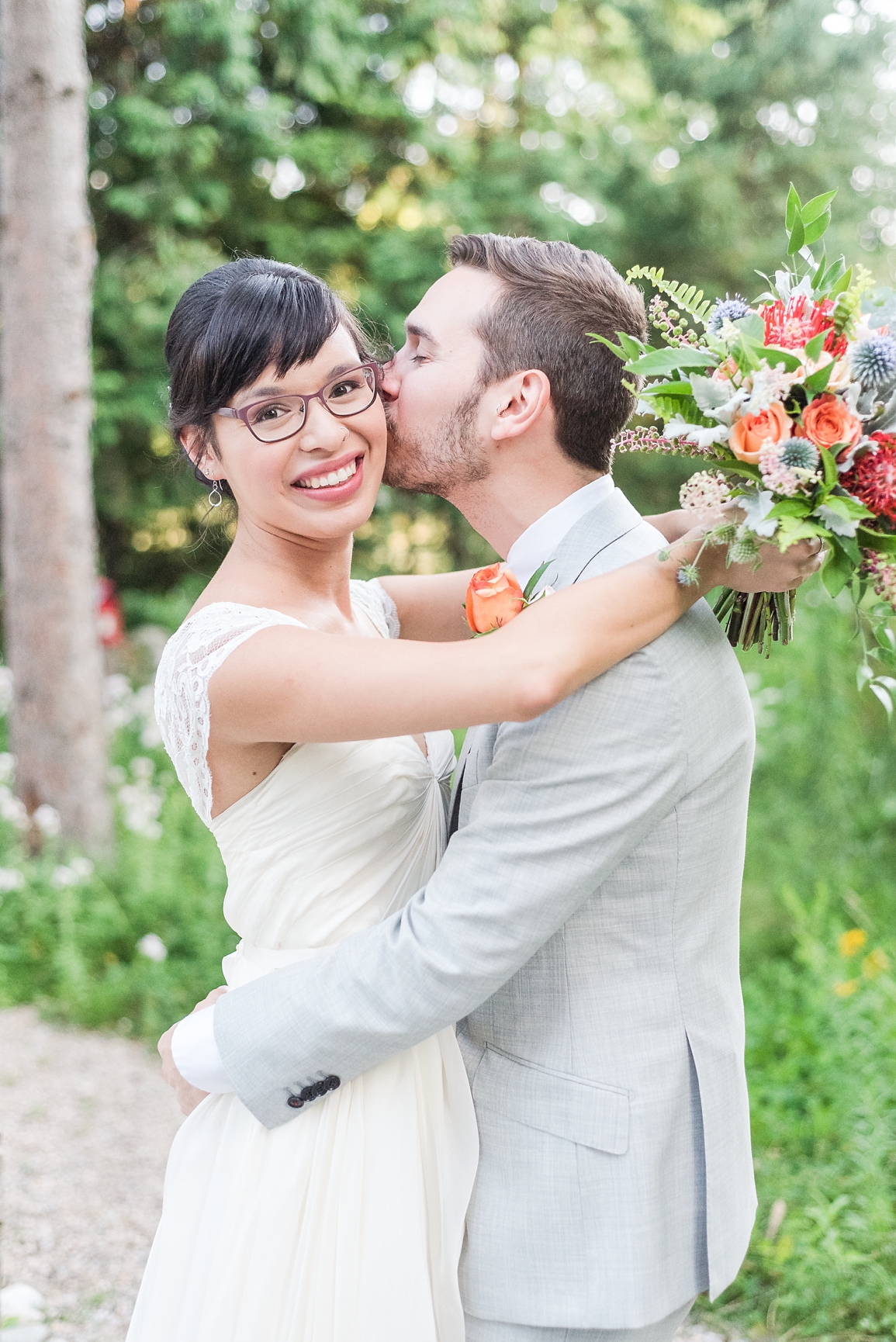 bride and groom portraits with bloomfields flowers